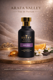 Derby perfume bottle with 'Arafa Valley' on a decorative platform with flowers and an orange.